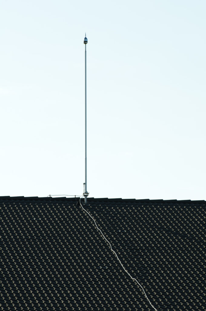 Lightning rod on the roof. Vertical image